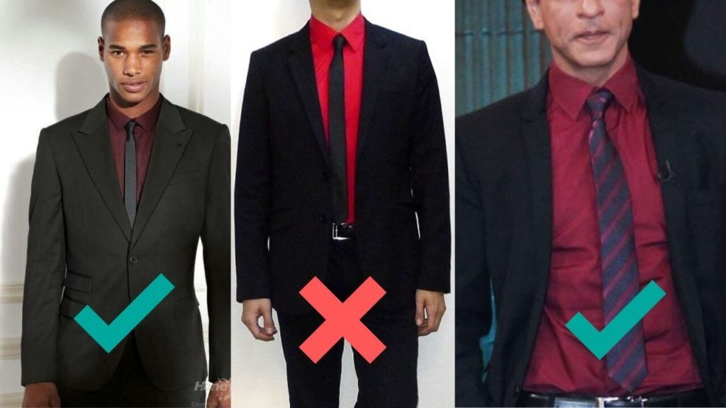 three men wearing black suit with a red shirt.
